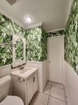 Ample-sized guest bathroom. We call this the banana leaf bath. No monkey business